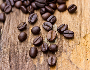 Coffee beans on wood background