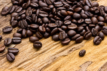 Coffee beans on wood background