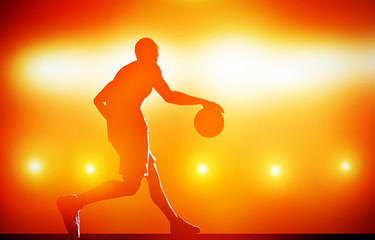 Basketball player silhouette dribbling with ball on red
