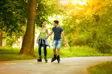 love couple ride rollerblades