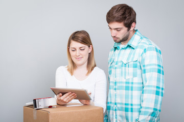 Couple calling transport company to move in new house