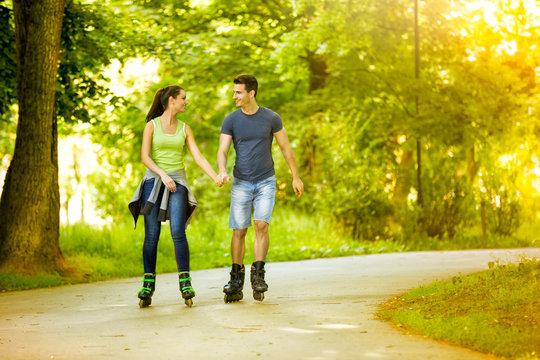 Lovers in nature on rollerblades