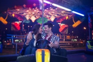 Affectionate couple in amusement park