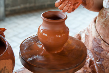 Potter making the pot in traditional style. Close up view