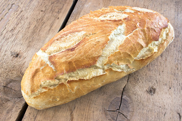 Fototapety  Domowy chleb na drewnianym tle