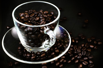 Glass cup of coffee beans