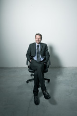 Businessman sitting on an office chair