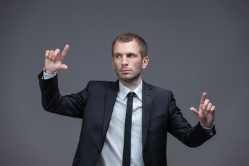 Portrait of business man pointing finger gestures
