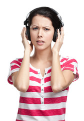 Woman with earphones listens to music, isolated on white