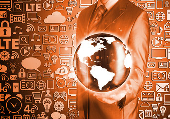 Businessman holds Earth in a hand