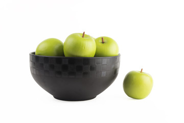 green apple in cup on a white background.