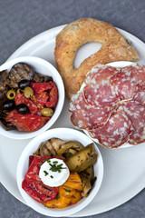 Peppers, eggplants, olives, zucchini, sausage, mozzarella and br