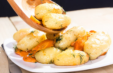 Roasted potatoes with carrot and tomatoes