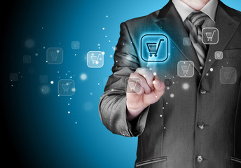 Businessman pushing shopping cart