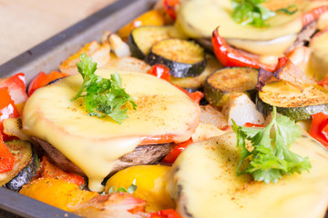 Baked mushrooms with cheese and parsley with vegetables