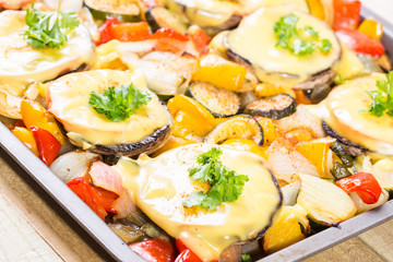 Baked mushrooms with cheese and parsley with vegetables