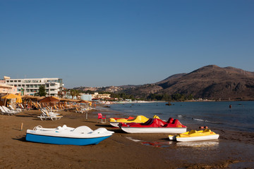 Fototapeta na wymiar Small boats on the beach of Georgioupolis