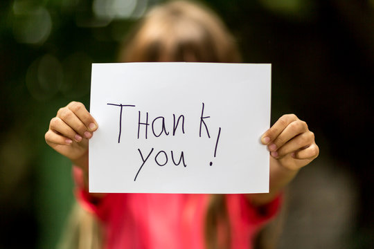 Girl with Thank You sign