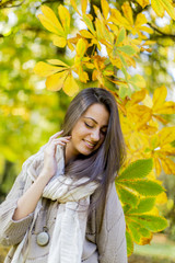 Young woman in autumn forest