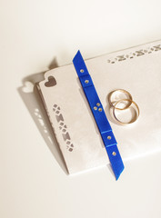 Wedding invitation with two golden rings