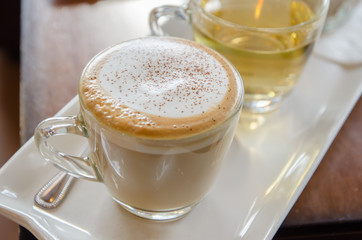 cappuccino with hot tea and sugar