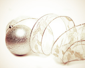 Beautiful silvery New Year's ball and elegant tinsel 