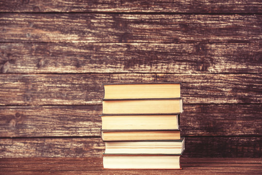 Open bood on wooden table.