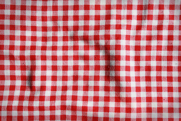 Texture of a red and white checkered picnic blanket.