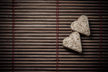 two sugar hearts on wooden texture - 66274181