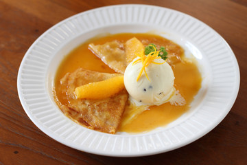 crepes with ice cream and orange sauce