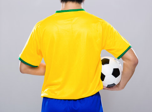 Brazil football player hold soccer ball