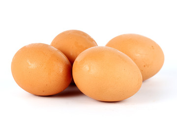 Four brown eggs