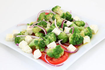 Broccoli salad with tomatoes and cheese