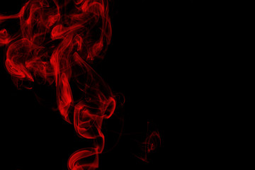 Red smoke on black background