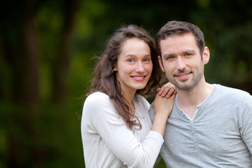 Obraz premium Portrait of a young happy couple in the nature
