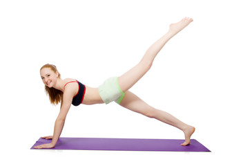 Young woman doing sport exercises isolated on white