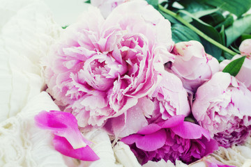 pink peonies and white wedding dress