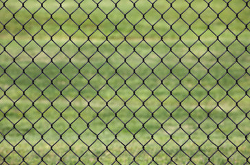 Metal fence, Detail of metal fence in a Green grass background