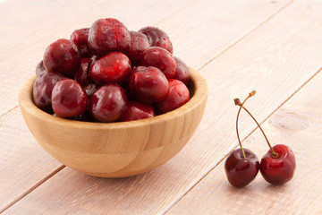 Bowl with red ripe cherries