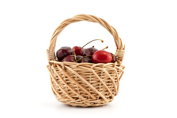 Basket with red ripe cherries