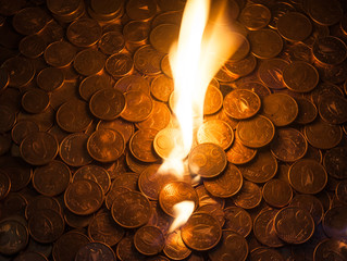 fire burning on euro coins