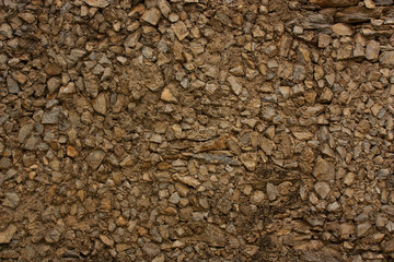 Wall made of stones with cement binder.
