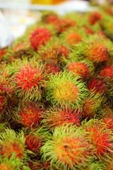 Sweet fruits rambutan in the market