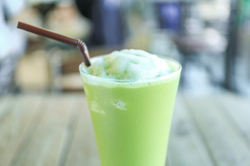 Ice Green tea with a straw