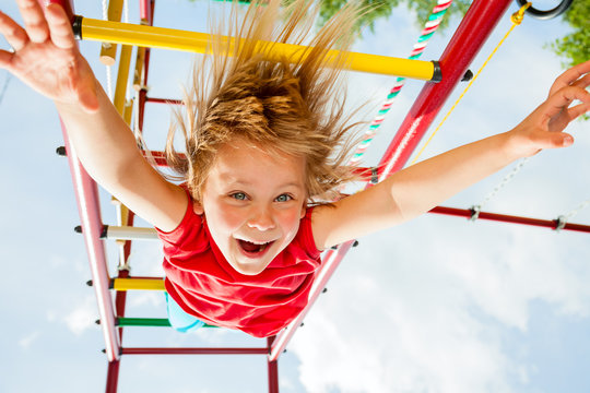 Happy Child On A Jungle Gym