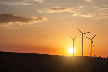 wind generator turbines on sunset