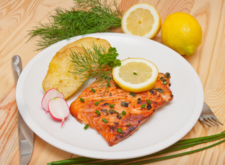 Grilled salmon fillet with boiled potatoes.  