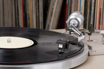 Turntable with vinyl records in the back