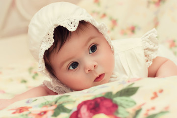 Fototapeta na wymiar Cute little girl in dress and hat