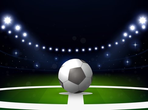 Soccer stadium with ball and spotlight at night